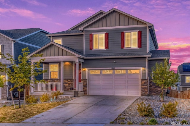 craftsman-style home featuring a garage and covered porch