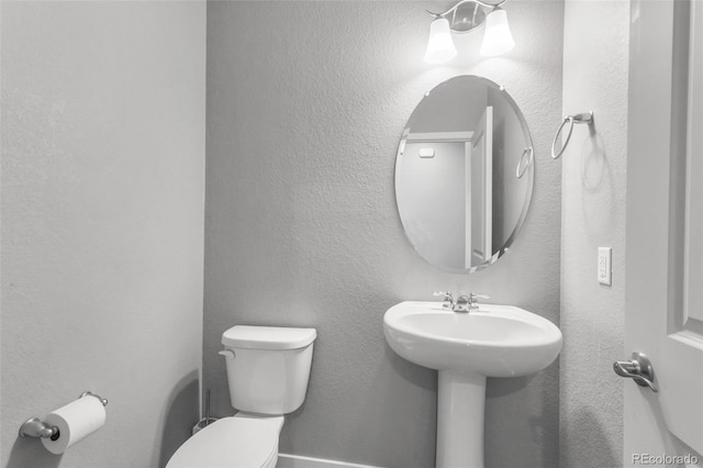 bathroom featuring sink and toilet