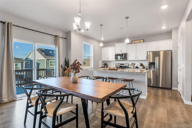 dining room featuring a chandelier and light hardwood / wood-style floors