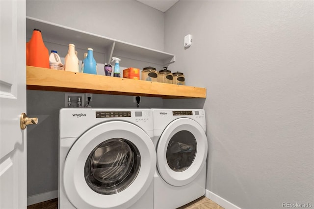 clothes washing area featuring washing machine and clothes dryer