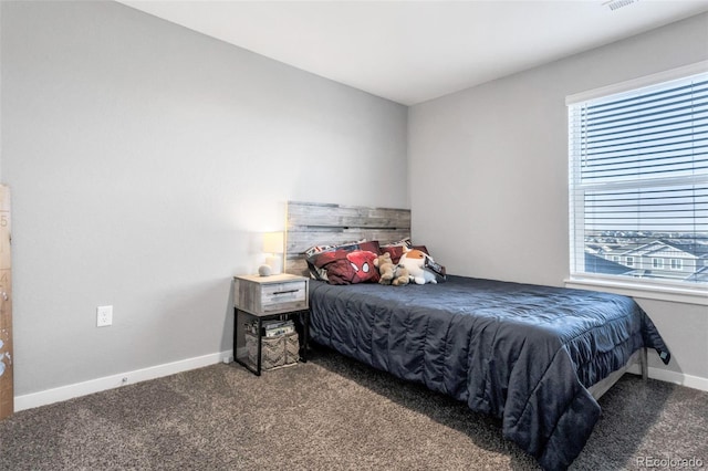 carpeted bedroom with multiple windows, visible vents, and baseboards