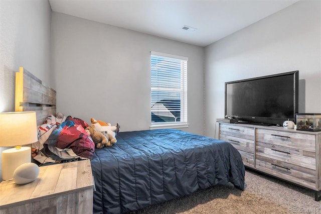 bedroom with carpet floors and visible vents