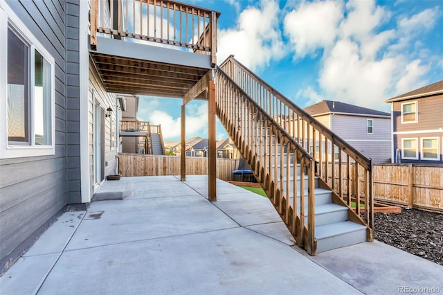 view of patio / terrace with a fenced backyard and stairs