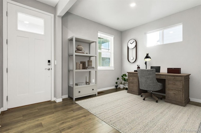 office area featuring baseboards and wood finished floors