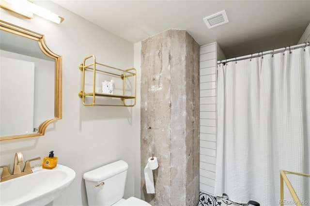 1801 Wynkoop St Unit 208, Denver, CO 80202 - bathroom featuring a sink, toilet, and curtained shower
