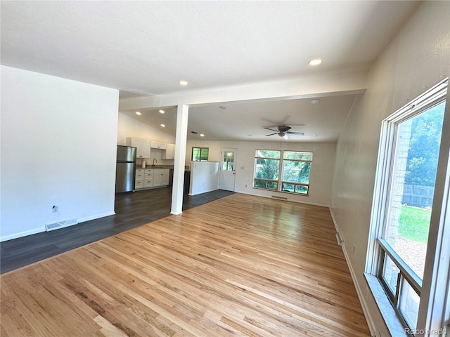 6040 W Elmhurst Dr, Littleton, CO 80128 - unfurnished living room with wood finished floors, ceiling fan, and recessed lighting