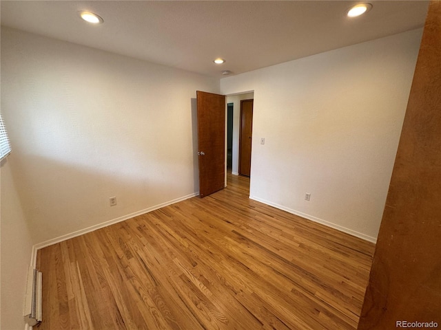 6040 W Elmhurst Dr, Littleton, CO 80128 - unfurnished room with wood finished floors, recessed lighting, and a smoke detector