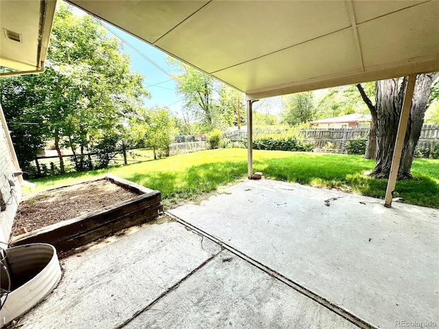 6040 W Elmhurst Dr, Littleton, CO 80128 - fenced backyard featuring a patio area