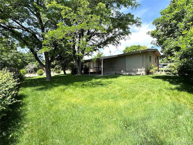 6040 W Elmhurst Dr, Littleton, CO 80128 - view of grassy yard