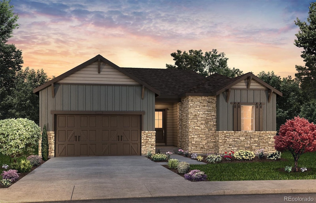 view of front of home featuring board and batten siding, stone siding, driveway, and an attached garage