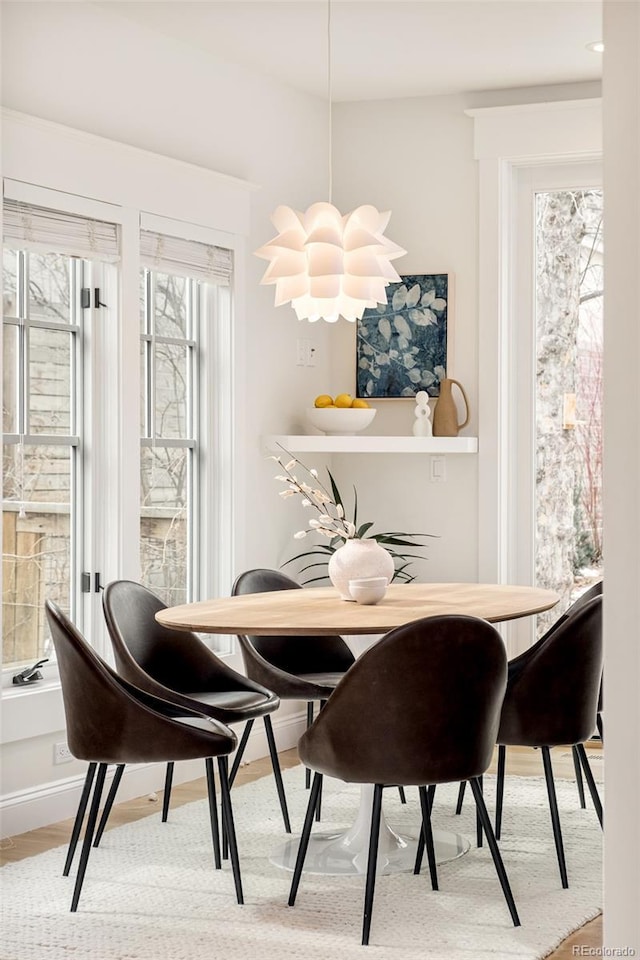 dining space featuring hardwood / wood-style flooring