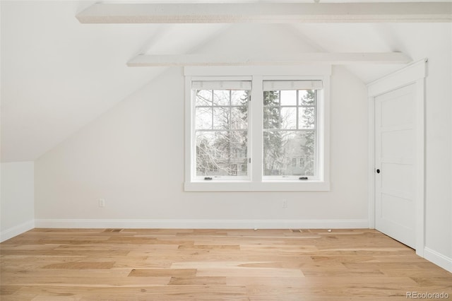 additional living space featuring lofted ceiling and wood-type flooring