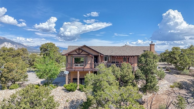 12850 County Road 261k, Nathrop, CO 81236 - view of front of house featuring stucco siding and a chimney