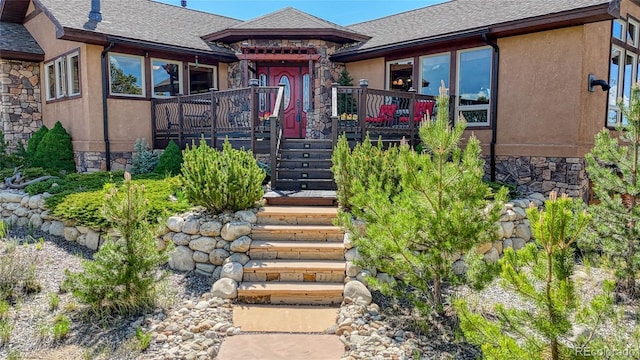 12850 County Road 261k, Nathrop, CO 81236 - view of front of house featuring stone siding, stucco siding, a shingled roof, and stairway
