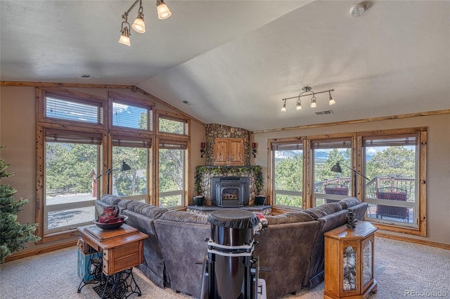 12850 County Road 261k, Nathrop, CO 81236 - living room with healthy amount of natural light, lofted ceiling, and light colored carpet