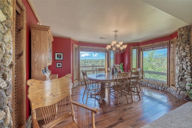 12850 County Road 261k, Nathrop, CO 81236 - dining space with wood-type flooring, a chandelier, and ornamental molding