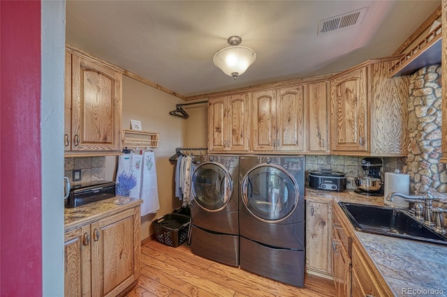 12850 County Road 261k, Nathrop, CO 81236 - laundry room featuring washer and clothes dryer and light wood-style floors