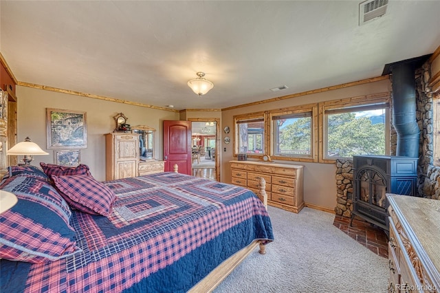 12850 County Road 261k, Nathrop, CO 81236 - bedroom with a wood stove and light carpet