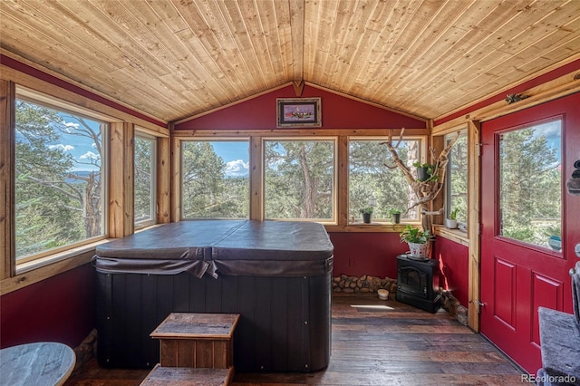 12850 County Road 261k, Nathrop, CO 81236 - sunroom / solarium featuring a jacuzzi, a wood stove, wooden ceiling, vaulted ceiling, and hardwood / wood-style floors