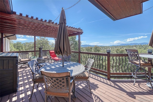 12850 County Road 261k, Nathrop, CO 81236 - wooden deck with a pergola, a mountain view, and outdoor dining space