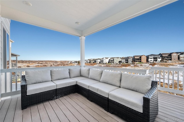 wooden terrace with an outdoor hangout area