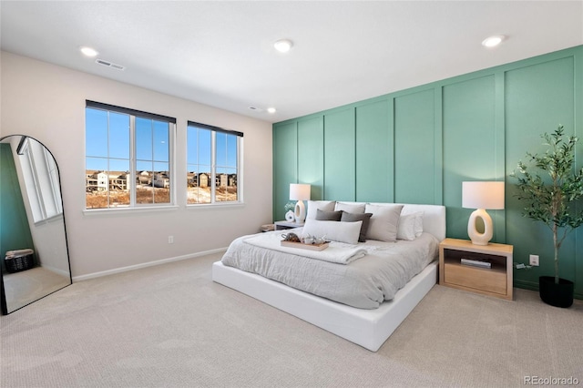 bedroom featuring light colored carpet