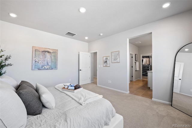 bedroom featuring light carpet