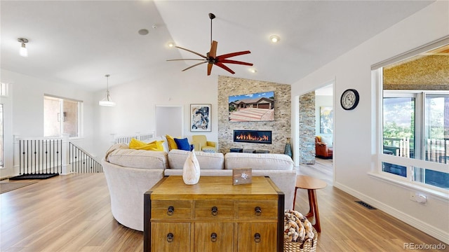 1246 Highland Pl, Erie, CO 80516 - living area with light wood finished floors, healthy amount of natural light, a ceiling fan, and lofted ceiling