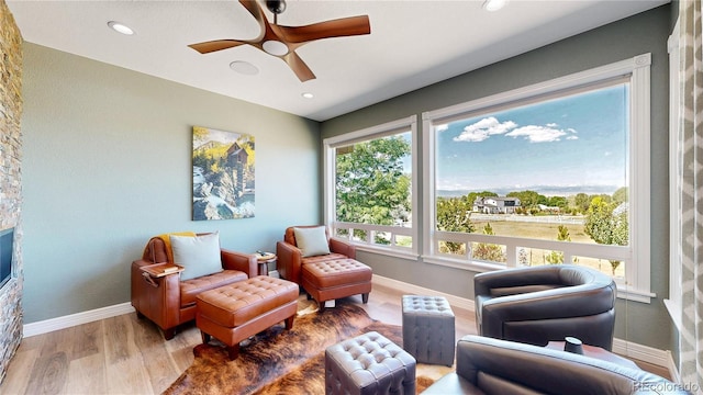 1246 Highland Pl, Erie, CO 80516 - living area featuring wood finished floors, a ceiling fan, and recessed lighting