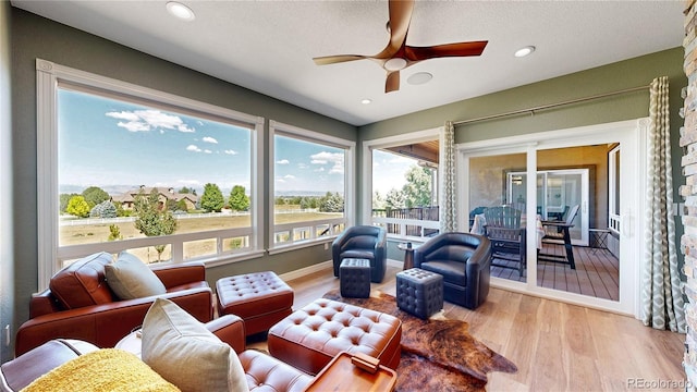 1246 Highland Pl, Erie, CO 80516 - sunroom featuring wood finished floors and recessed lighting