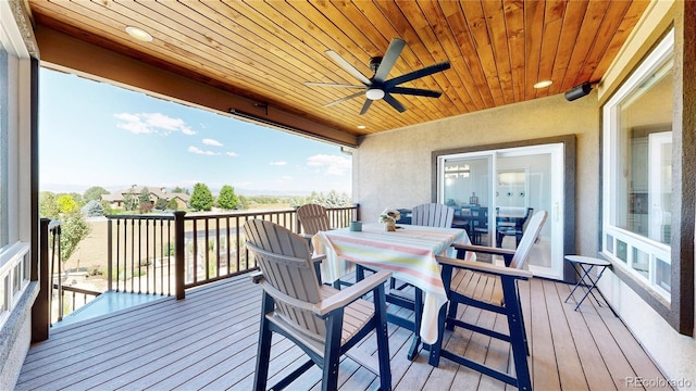 1246 Highland Pl, Erie, CO 80516 - wooden deck with a ceiling fan and outdoor dining space