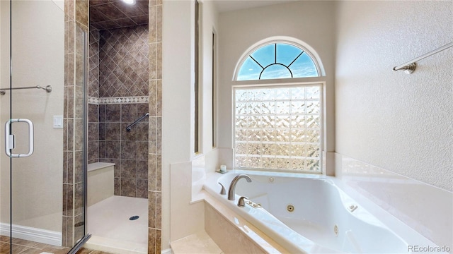 1246 Highland Pl, Erie, CO 80516 - full bathroom with a shower stall, a jetted tub, and a textured wall