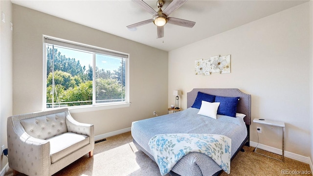 1246 Highland Pl, Erie, CO 80516 - carpeted bedroom with baseboards and ceiling fan