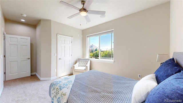1246 Highland Pl, Erie, CO 80516 - bedroom featuring light carpet and a ceiling fan
