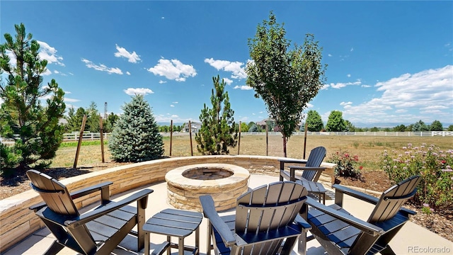 1246 Highland Pl, Erie, CO 80516 - view of patio with an outdoor fire pit and a view of rural / pastoral area