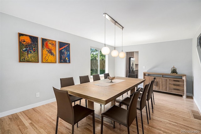 9673 Pinebrook St, Highlands Ranch, CO 80130 - dining area featuring light wood-style flooring and baseboards