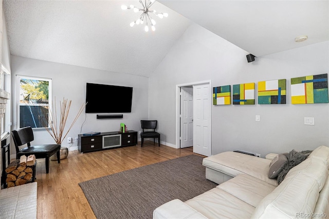 9673 Pinebrook St, Highlands Ranch, CO 80130 - living room featuring a chandelier, wood finished floors, high vaulted ceiling, and baseboards