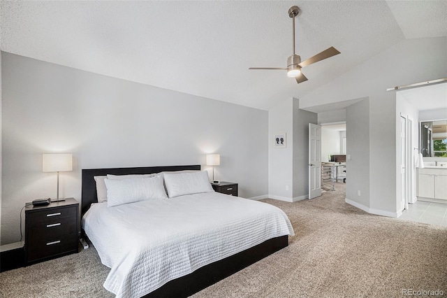9673 Pinebrook St, Highlands Ranch, CO 80130 - bedroom featuring lofted ceiling, light carpet, baseboards, ensuite bath, and ceiling fan