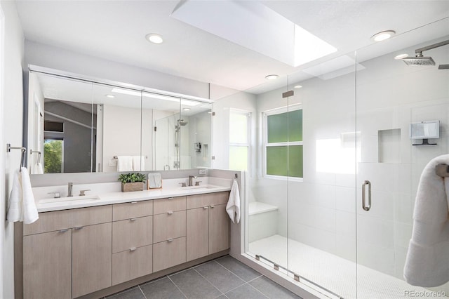 9673 Pinebrook St, Highlands Ranch, CO 80130 - full bath featuring double vanity, a shower stall, tile patterned flooring, recessed lighting, and a skylight