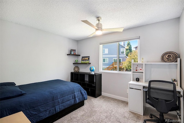 9673 Pinebrook St, Highlands Ranch, CO 80130 - bedroom featuring light colored carpet, an office area, baseboards, a textured ceiling, and ceiling fan