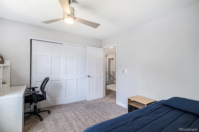 9673 Pinebrook St, Highlands Ranch, CO 80130 - carpeted bedroom featuring a closet, a textured ceiling, ceiling fan, and an office area