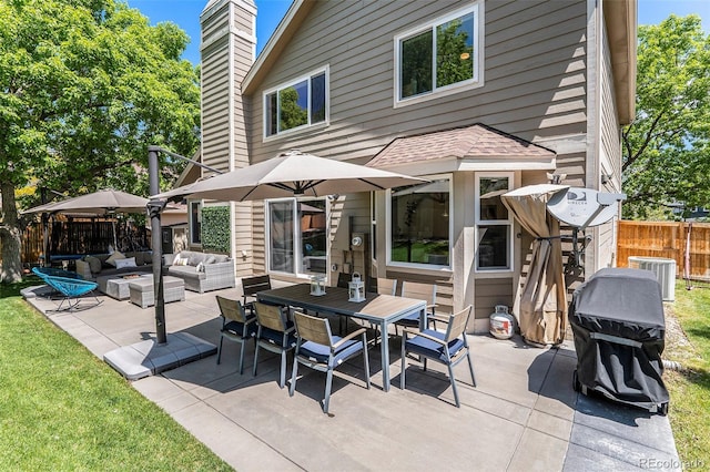 9673 Pinebrook St, Highlands Ranch, CO 80130 - view of patio / terrace with an outdoor living space, central AC, and outdoor dining space