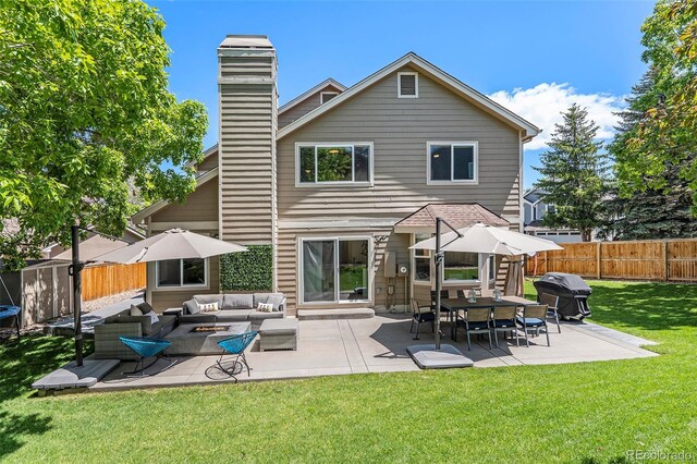 9673 Pinebrook St, Highlands Ranch, CO 80130 - back of property featuring an outdoor living space, a patio area, and a chimney