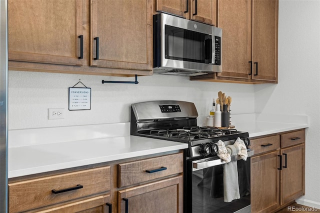 1228 Argali Dr, Severance, CO 80550 - kitchen featuring appliances with stainless steel finishes and light countertops