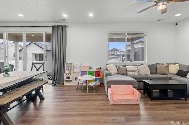 1228 Argali Dr, Severance, CO 80550 - living room featuring ceiling fan, wood finished floors, and recessed lighting