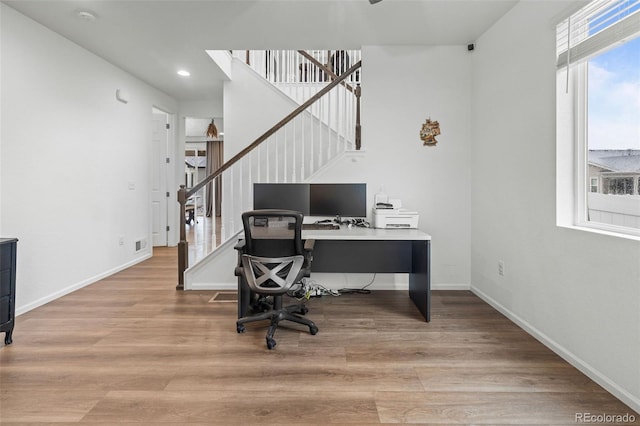 1228 Argali Dr, Severance, CO 80550 - office area with wood finished floors, baseboards, and recessed lighting