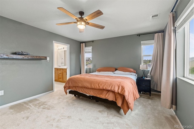 1228 Argali Dr, Severance, CO 80550 - bedroom featuring light carpet, baseboards, ensuite bathroom, and a ceiling fan