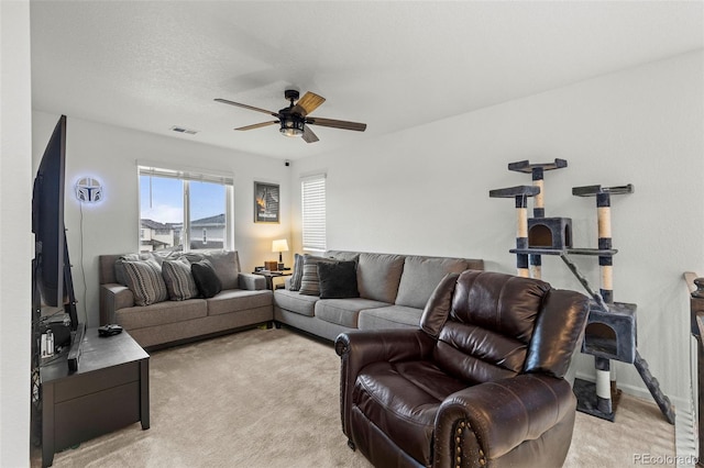 1228 Argali Dr, Severance, CO 80550 - living area featuring ceiling fan and light carpet