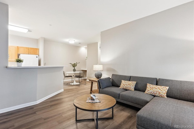 9692 W Coco Cir Unit 103, Littleton, CO 80128 - living room with wood finished floors and baseboards