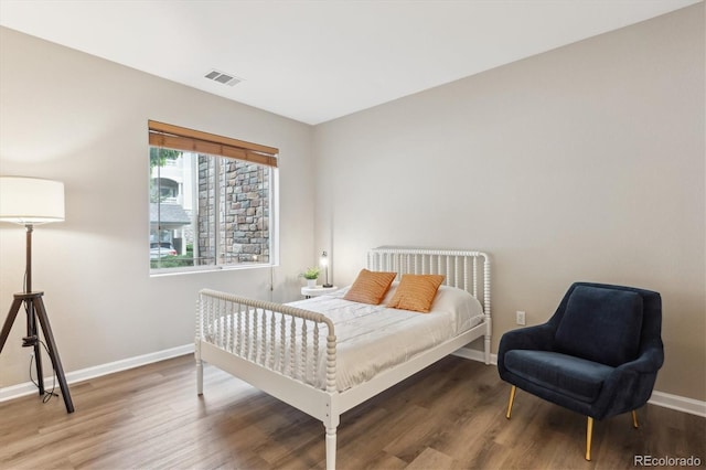 9692 W Coco Cir Unit 103, Littleton, CO 80128 - bedroom featuring baseboards and wood finished floors